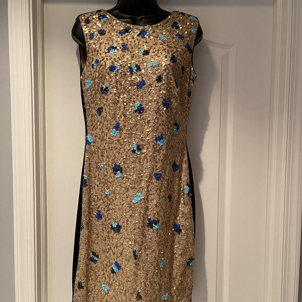 Gold sequin design. Black back size 10
